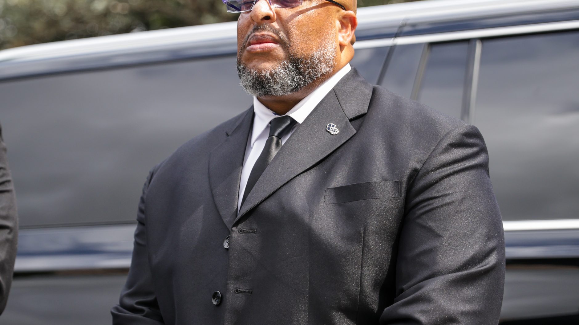 An ARDENT Executive Protection Agent working an arrival, framed so no client is identifiable.