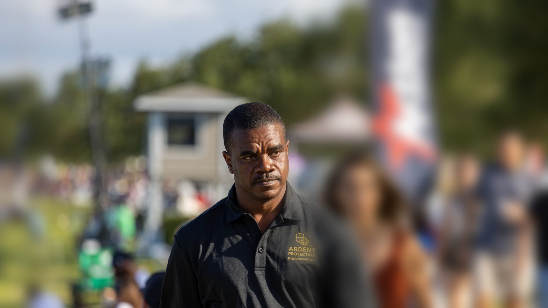 An ARDENT Event Security Officer working a controlled entrance as guests arrive.